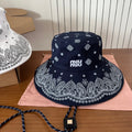 MM BUCKET IN BLACK FABRIC WITH EMBROIDERED PATTERN