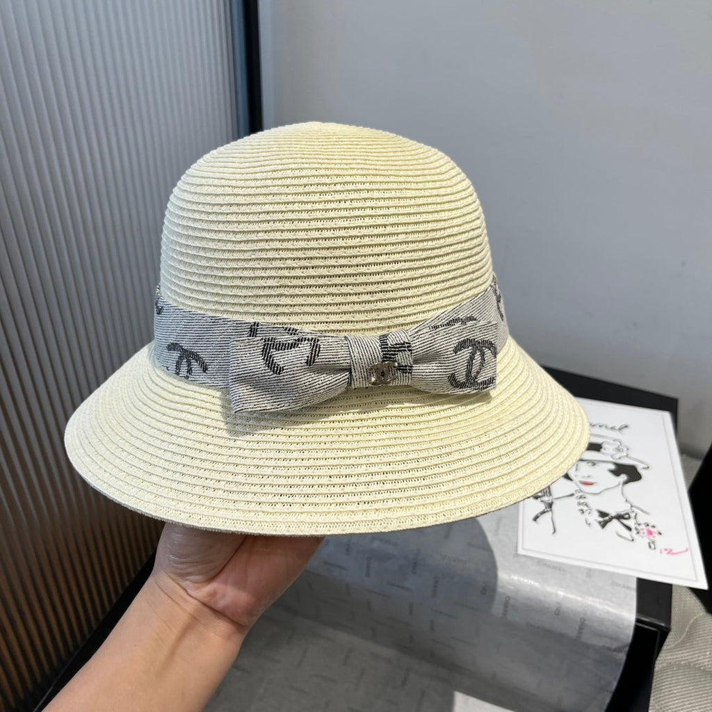 STRAW BUCKET HAT IN IVORY WITH RIBBON BOW 673977