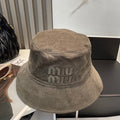 MM BUCKET IN MUTED BROWN VELVET WITH LOGO